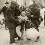 Belgian refugees in Antwerp - a family fleeing the German soldiers on a bicycle