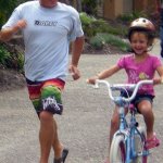 Get your kids to ride bikes by spending time with them. Plus, the exercise is good for parents too - and fun for all!
