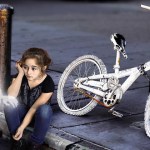 Some of the most haunting images in Don't Forget Me: Ghost Bikes are of ghostly children next to ghost bikes.