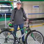 Mark Cramer in a station at the La Paz aerial cable car public transportation system, called Teleférico. Cyclists are allowed to take bikes into these cabins, using their bikes part-way in a commute to get over the most hilly part by blending with public transit