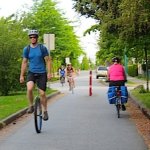 unicyclist on protected bike lane in Vancouver - Average Joe Cyclist